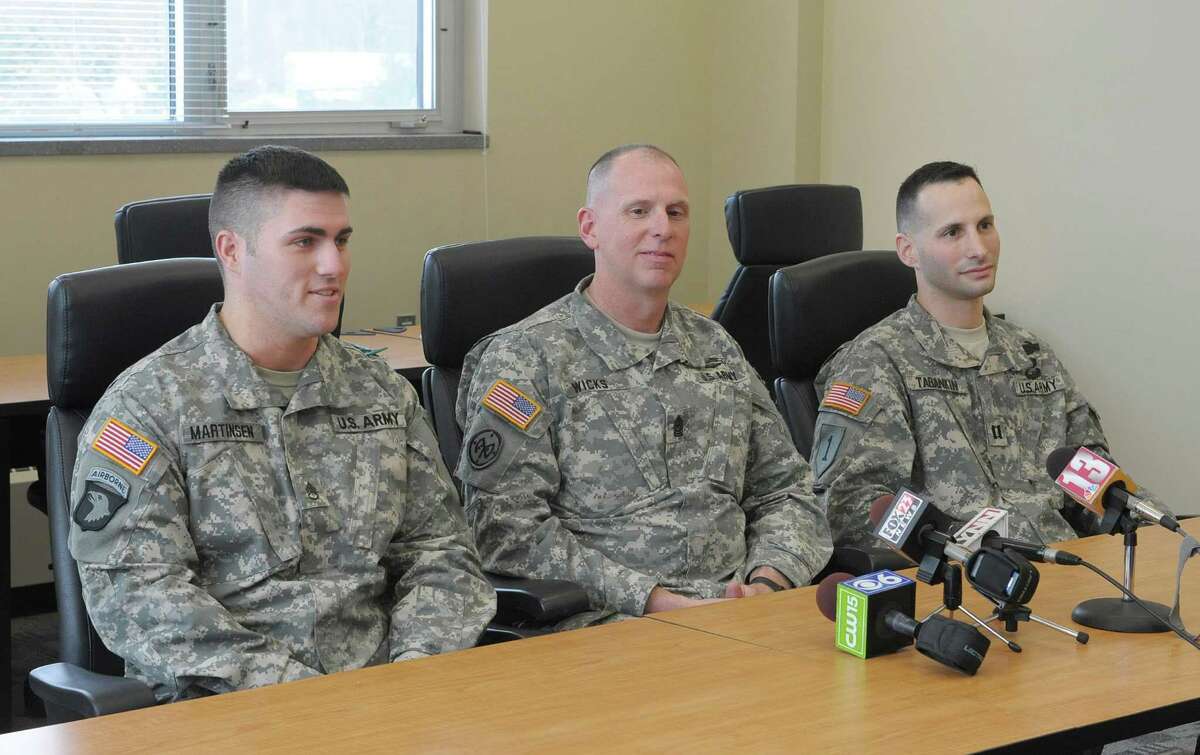 Members of the New York Army National Guard, from left to right, Staff Sgt. David Martinsen, of Troy, New York State Command Sgt. Major Frank Wicks, of West Sand Lake and Captain Shawn Tabankin, of Rexford, talk to members of the media during an interview at the New York Army National Guard headquarters on Thursday, Jan. 17, 2013 in Latham, NY. The three men will be attending with a guest the Commander-in-Chief's Inaugural Ball on Monday, January 21st in Washington. All three service members are veterans of the wars in Iraq and Afghanistan. Tabankin has been awarded the Purple Heart and Martinsen was the New York Army National Guard full-time Non-Commissioned Officer of the Year for 2012. (Paul Buckowski / Times Union)