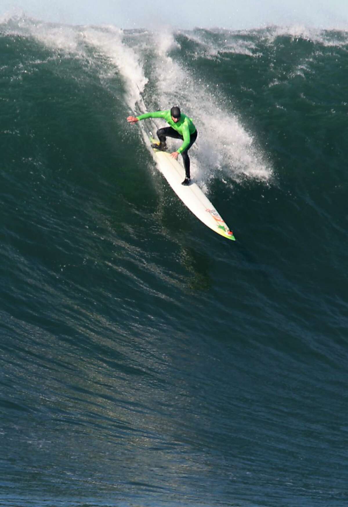 Grant Baker drops into a wave during the first round of the Mavericks Invitational on Sunday, January 20, 2013.