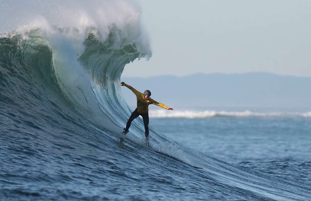 Alex Martins, who placed fourth overall, takes off on a wave during the finals of the Mavericks Invitational on Sunday, January 20, 2013.