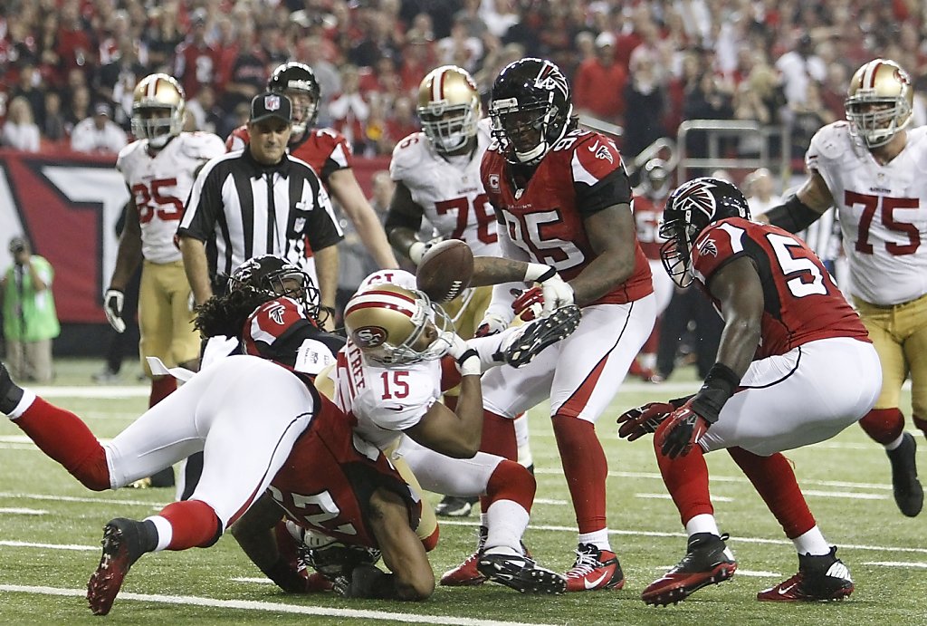 San Francisco 49ers Linebacker Aldon Smith (99), Defensive tackle Ray  McDonald (91), Linebacker NaVorro Bowman (53 and Offensive tackle Joe  Staley (74) pick up Atlanta Falcons running back Jacquizz Rodgers (32)  during