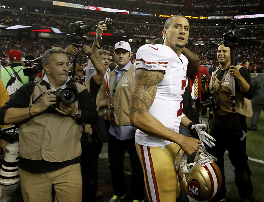 San Francisco 49ers Linebacker Aldon Smith (99), Defensive tackle Ray  McDonald (91), Linebacker NaVorro Bowman (53 and Offensive tackle Joe  Staley (74) pick up Atlanta Falcons running back Jacquizz Rodgers (32)  during