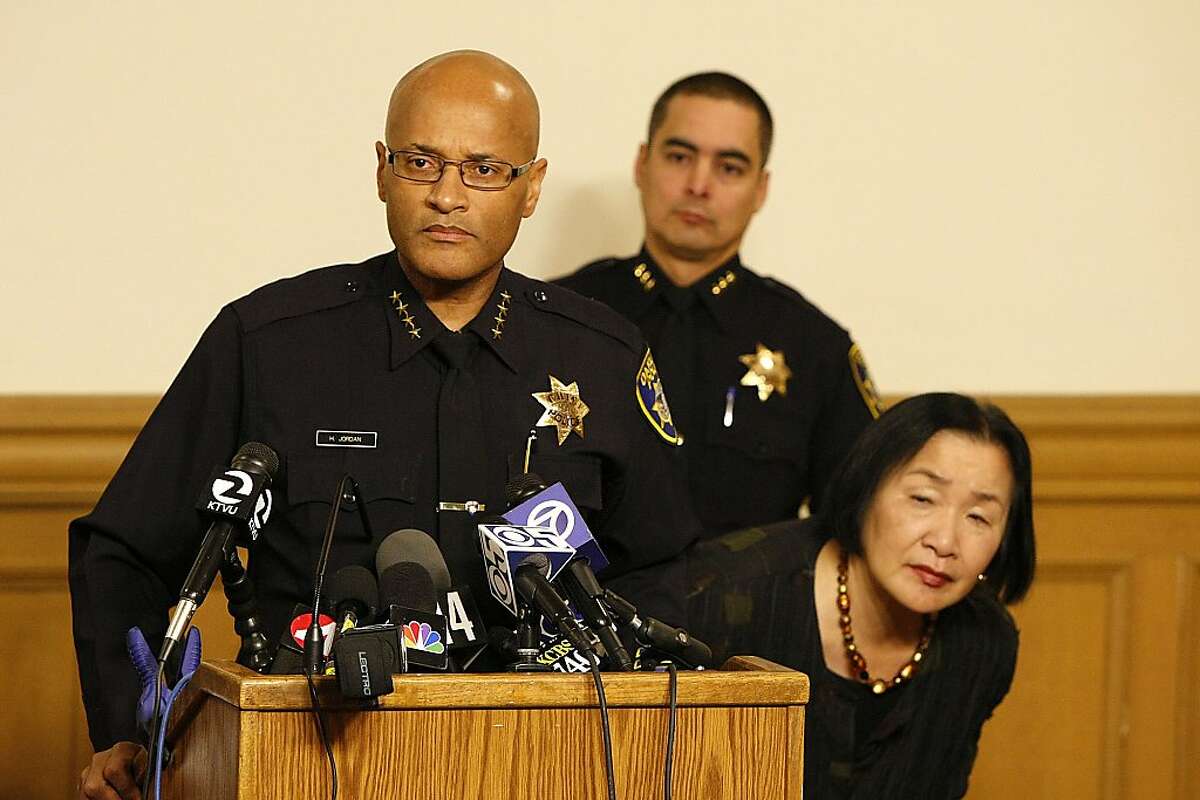 Oakland Police Chief, Howard Jordan, and Oakland Mayor, Jean Quan, strain to hear a question during at a press conference at City Hall on December 27, 2012 in Oakland.