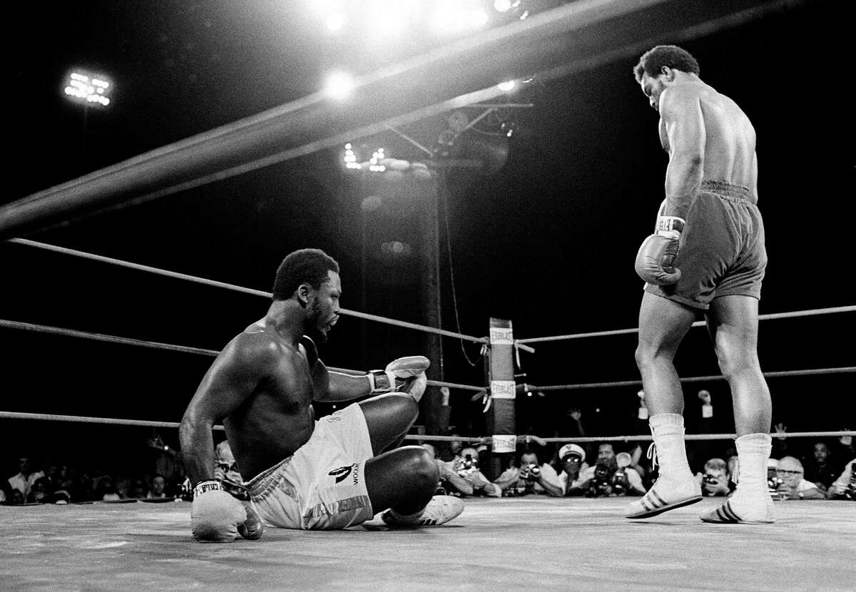 George Foreman, right, sent Joe Frazier to the canvas six times in less than two rounds to claim Frazier's heavyweight championship in a bout at Kingston, Jamaica, on Jan. 22, 1973. Foreman, who was 24 at the time, would retire in 1977 but come back to win a share of the title in 1994 at age 45.
