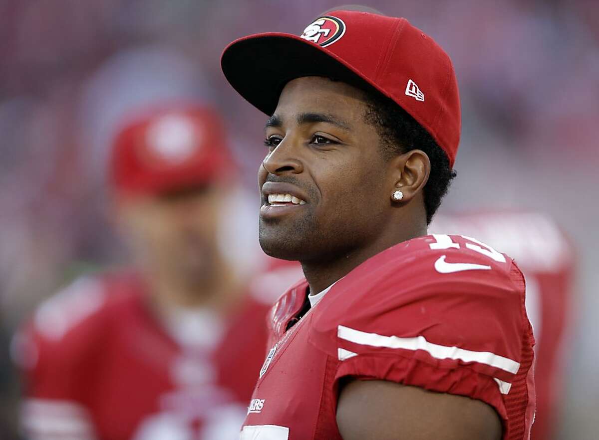 San Francisco 49ers wide receiver Michael Crabtree (15) looks on from the sideline during an NFL football game against the Arizona Cardinals in San Francisco, Sunday, Dec. 30, 2012. (AP Photo/Marcio Jose Sanchez)