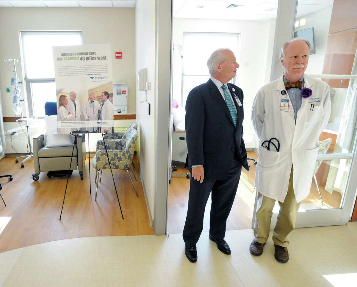 At left, Frank Corvino, president & CEO of Greenwich Hospital and Dickerman Hollister, Jr., medical director of the Bendheim Cancer Center, prior to the Greenwich Hospita/Yale New Haven Health ribbon-cutting ceremony to mark the opening of the newly renovated Bendheim Cancer Center at 77 Lafayette Place , Greenwich, Jan. 22, Tuesday afternoon, 2013.