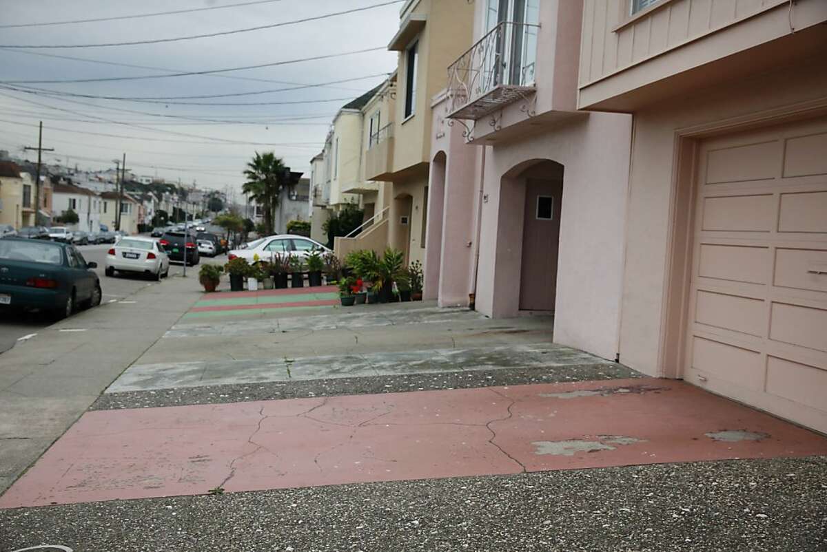 Several front yards paved over in front of homes in the Outer Sunset along 30th Avenue are seen on Wednesday, January 23, 2013 in San Francisco, Calif.