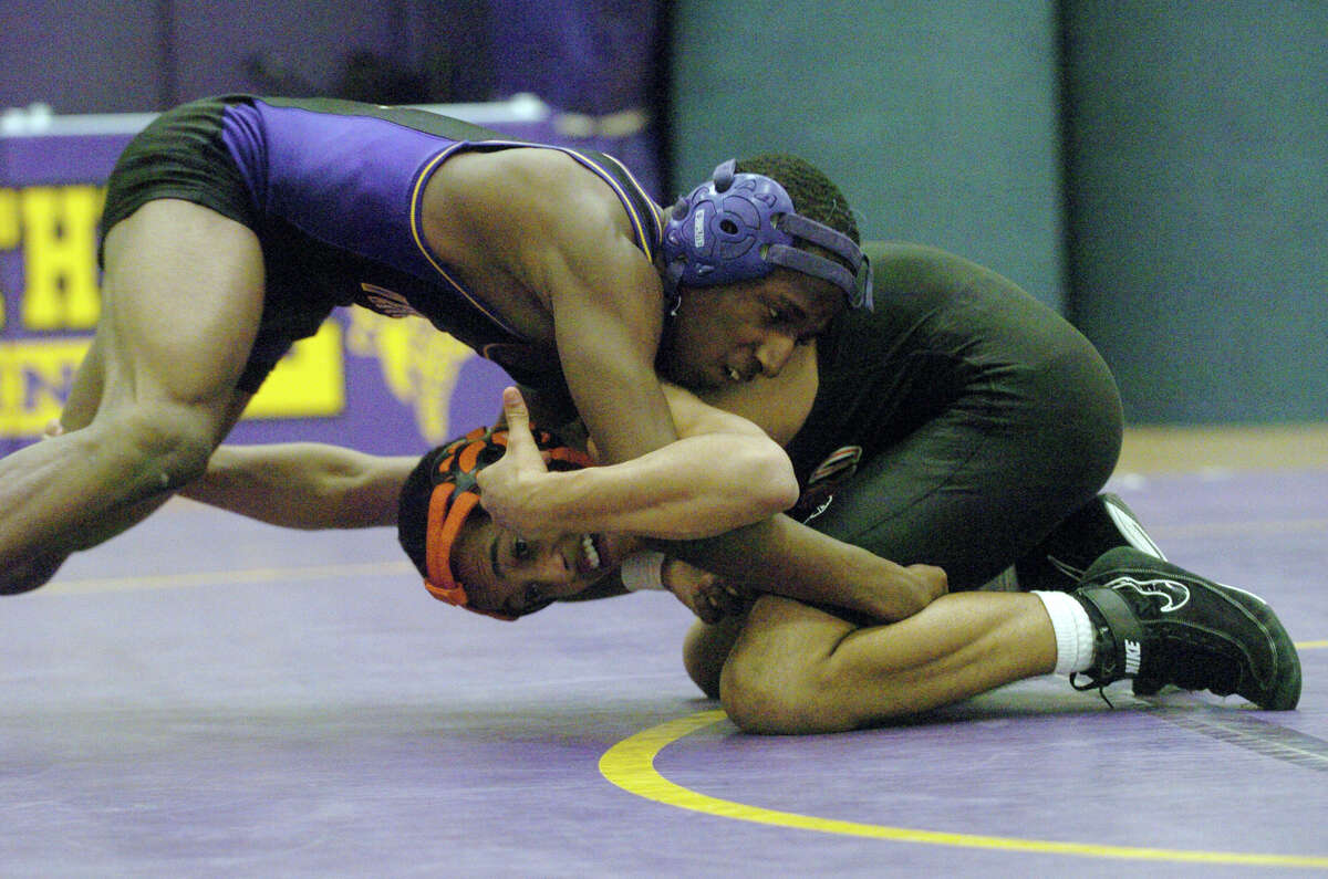 Westhill's Jeff Glover and Stamford's Mohammad Abdul in the 132 pound bout as Westhill hosts Stamford High School in a wrestling match in Stamford, Conn., Jan. 23, 2013.