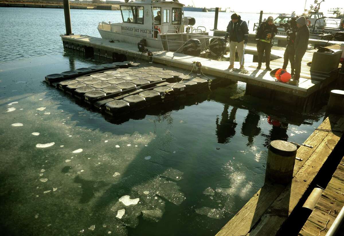The Bridgeport Police Dive Team conducts underwater search exercises from the Water Street Dock on Bridgeport Harbor on Wednesday, January, 23, 2013. The water was about 40 degrees, warm compared to the air temperatures which hovered in the single digits.