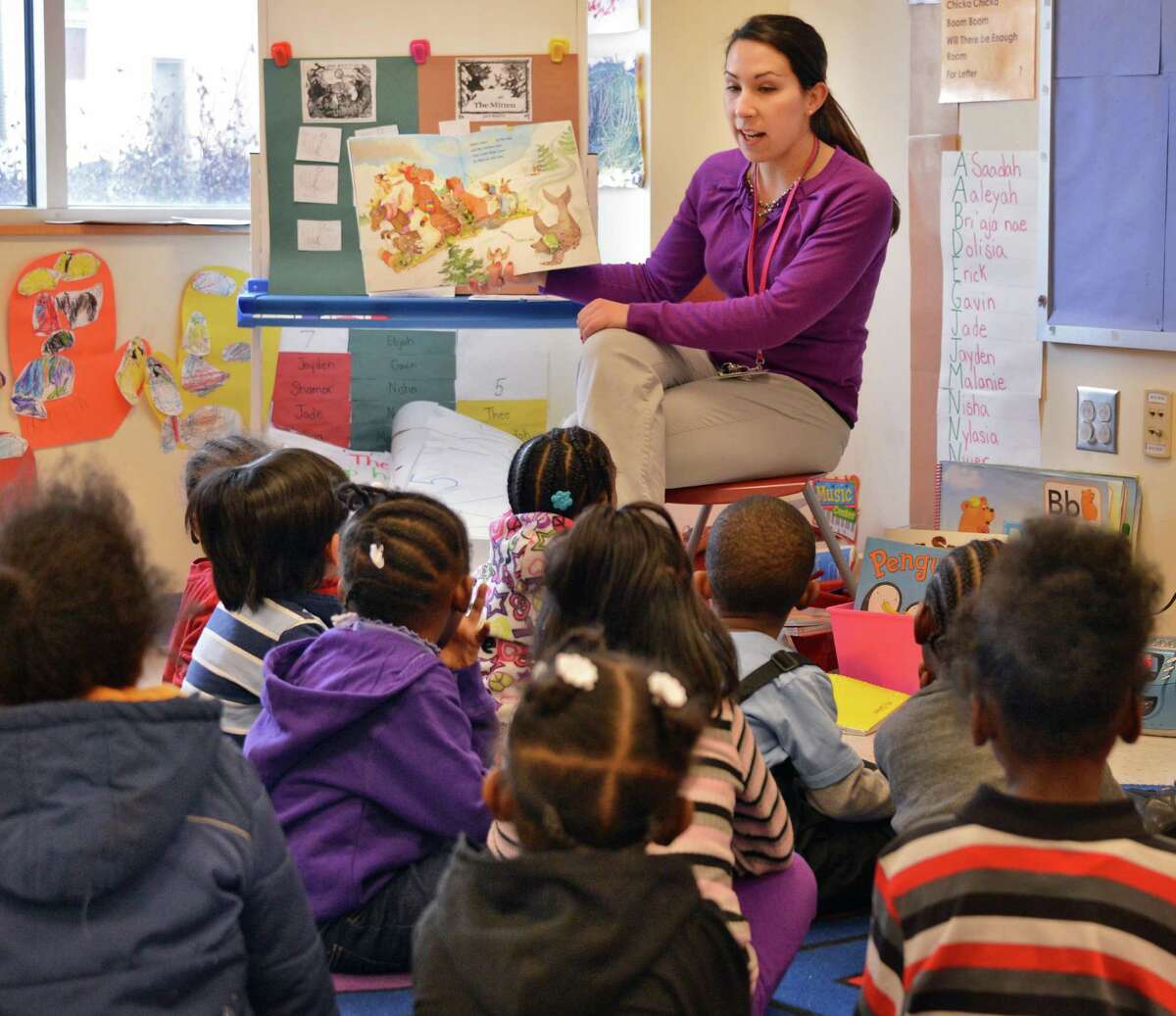 Pre-kindergarten teacher Rebecca DeNyse reads to her class at Sheridan Preparatory Academy in Albany Tuesday Jan. 22, 2013. (John Carl D'Annibale / Times Union)