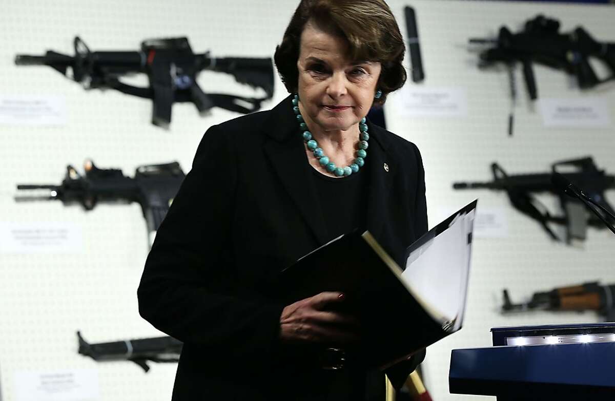 WASHINGTON, DC - JANUARY 24: U.S. Sen. Dianne Feinstein (D-CA) stands next to a display of assault weapons during a news conference January 24, 2013 on Capitol Hill in Washington, DC. Feinstein announced that she will introduce a bill to ban assault weapons and high-capacity magazines capable of holding more than 10 rounds to help to stop gun violence (Photo by Alex Wong/Getty Images)