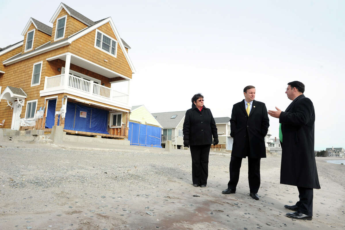 Senator Chris Murphy, center, stands with Mayor Ben Blake and State Rep. Kim Rose during a tour of Bayview Beach, in Milford, Conn., Jan. 25th, 2013.