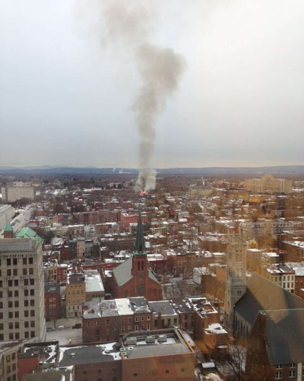 Smoke rises from the 2 alarm fire at 159 Dove Street Friday afternoon in Albany, N.Y. (Reader submitted photo)