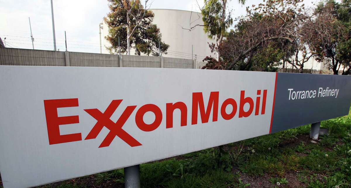 This Jan. 30, 2012 photo shows the sign for the ExxonMobil Torerance Refinery in Torrance, Calif. Exxon has once again surpassed Apple as the world's most valuable company after the iPhone and iPad maker saw its stock price falter, according to reports Friday, Jan. 25, 2013. Apple first surpassed Exxon in the summer of 2011. The two companies traded places through that fall, until Apple surpassed Exxon for good in early 2012. (AP Photo/Reed Saxon, File)