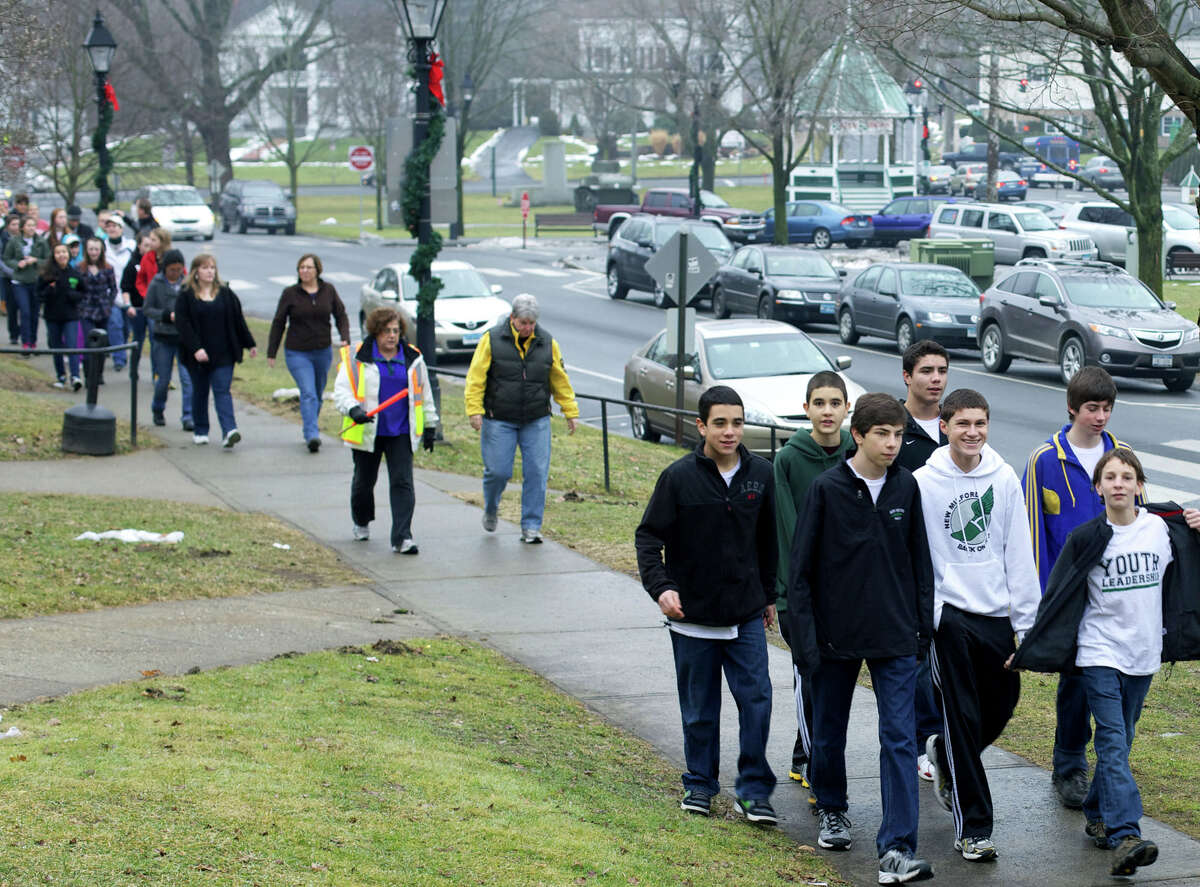'Cold homes, warm hearts' Members of New Milford High School's United Way Youth Leadership group show the way during New Milford Social Services' annual "Cold Homes, Warm Hearts" five-kiolmeter walk around the village center. The Jan. 13 event benefited the community fuel bank. Among the NMHS students shown here are John Vazquez, Eric Vazquez, Gabe Hack, Hugh Sichel and Greg Hansel.