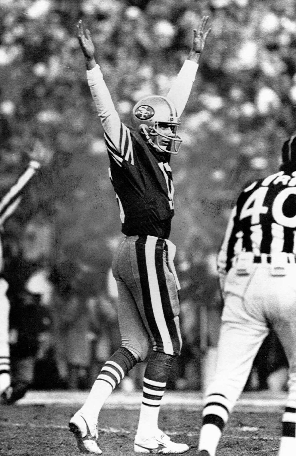 49ers quarterback Joe Montana throws up his arms in reaction to a first half touchdown by Roger Craig in Super Bowl XIX Sunday.