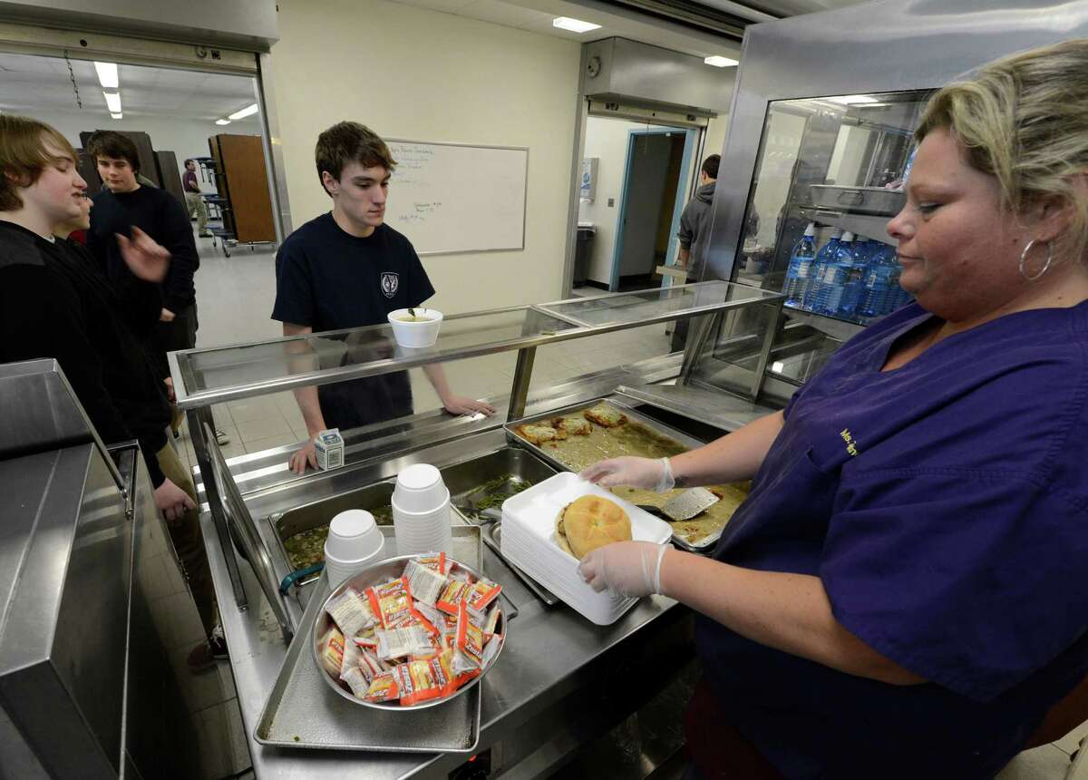 Liza Zautner prepares lunches during the lunch recess Jan. 28, 2013 at the Voorheesville High School in Voorheesville, N.Y. (Skip Dickstein/Times Union)