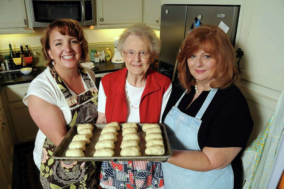 Victoria, from left, her grandmother Elsie Monk and mother, Karen Rittinger, are ready to put a batch of kolaches in the oven at Victoria's downtown Houston loft.