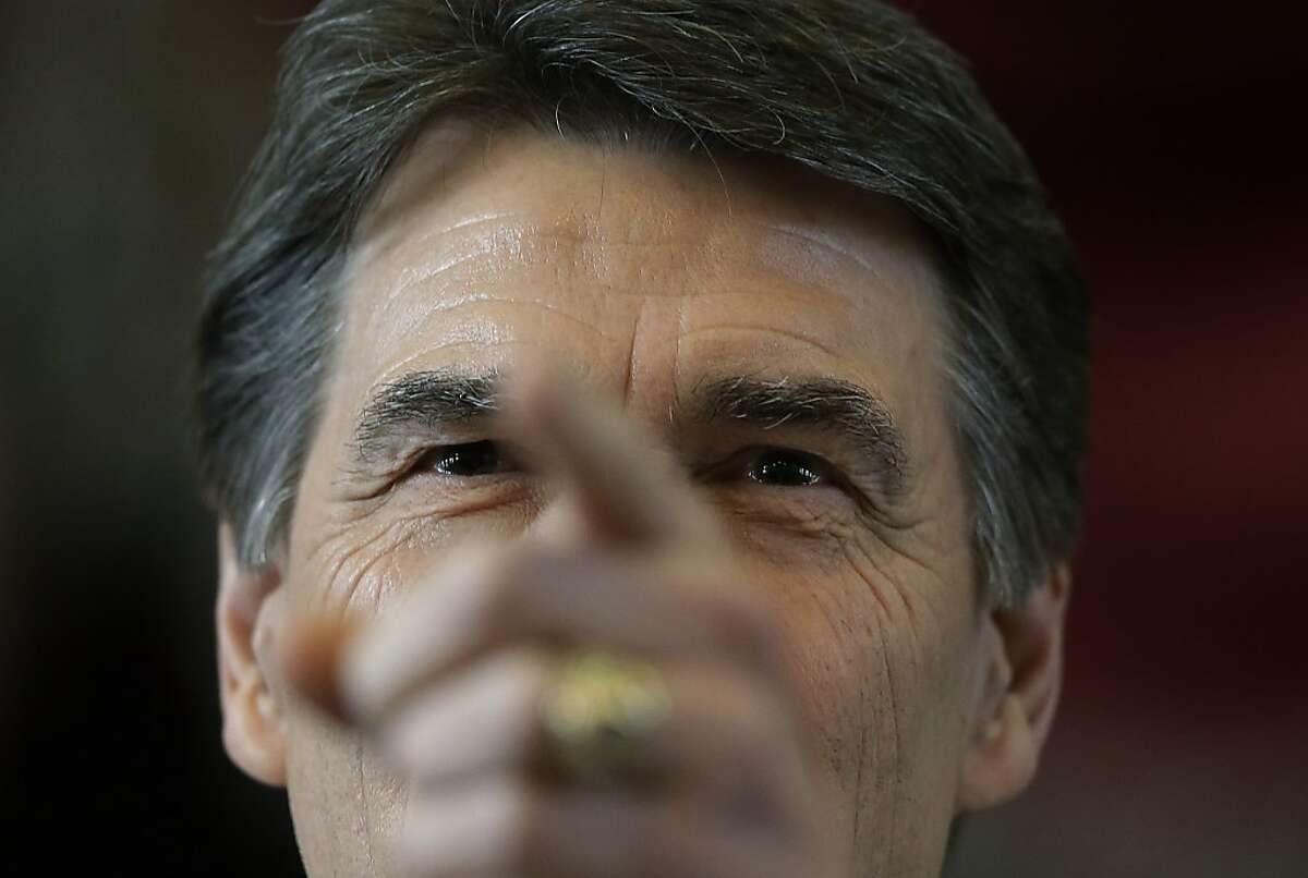 Texas Gov. Rick Perry delivers the state of the state address in the house chambers at the state capitol, Tuesday, Jan. 29, 2013, in Austin, Texas. (AP Photo/Eric Gay)