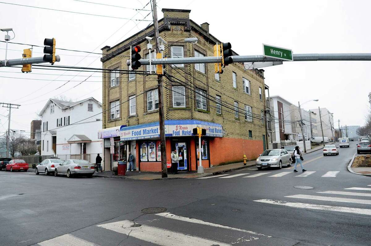 El Mercado Food Market and Your's Unisex hair salon occupy a building the state is proposing to demolish at the intersection of Henry and Atlantic Streets in Stamford.