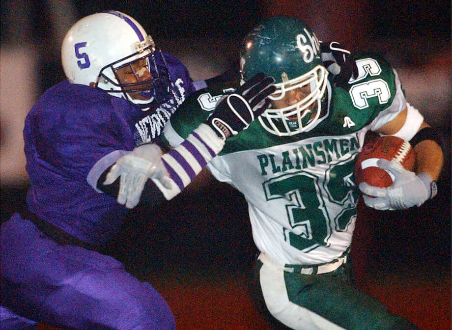 Times Union Photo by James Goolsby Nov.21, 2003-Shen #39-RB-Isaac Williams is chased by New Rochelle #5-Raymell Rice. In the second half of the Class AA State Semifinal game in Kingston N.Y. Photo: JAMES GOOLSBY / ALBANY TIMES UNION