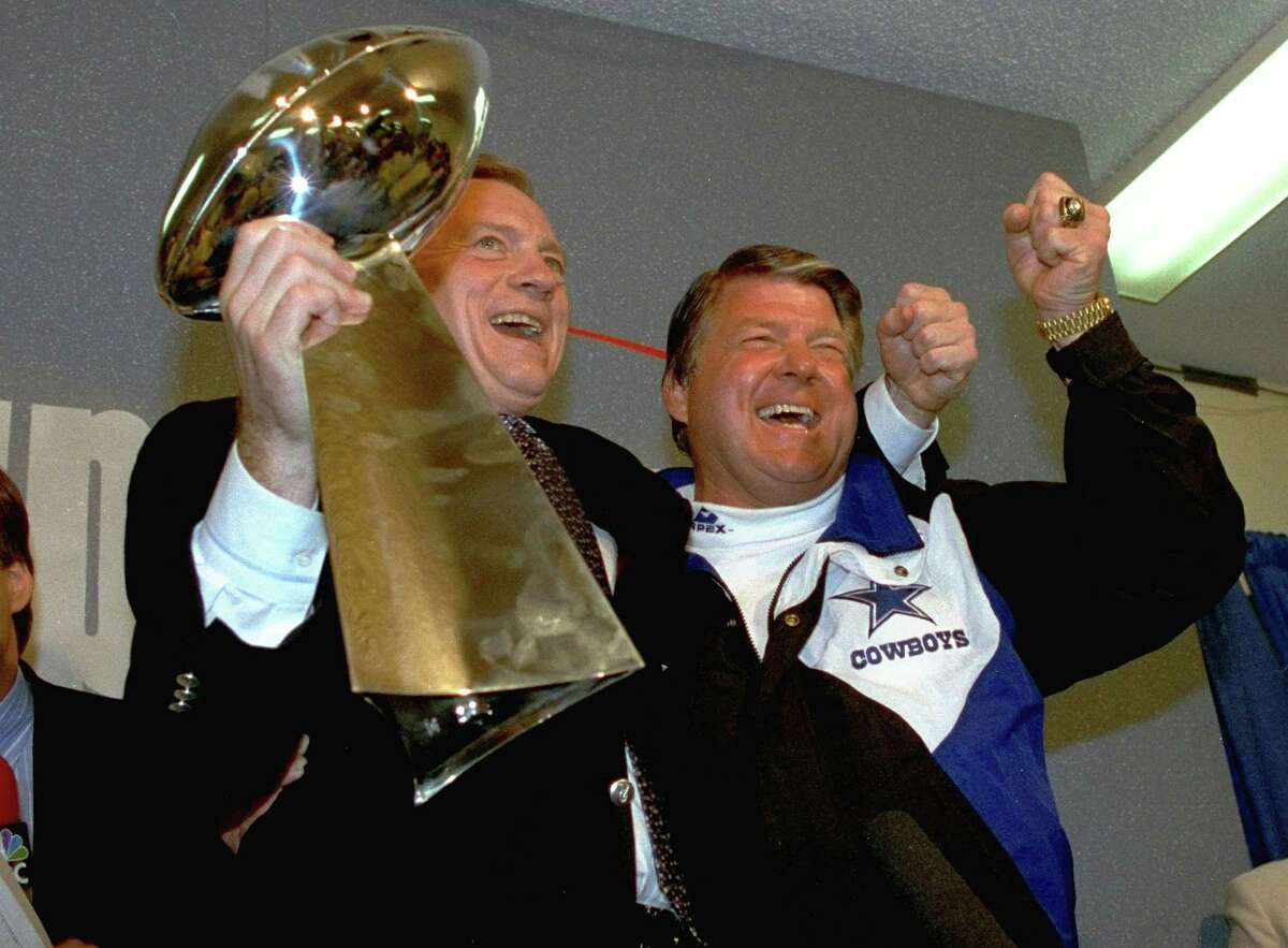In this Jan. 31, 1993 file photo, Dallas Cowboys head coach Jimmy Johnson, right, and owner Jerry Jones, hold up the Vince Lombardi Trophy as they celebrate their 52-17 win over the Buffalo Bills in Super Bowl XXVII in Pasadena, Calif. Johnson made 51 trades in his five years in Dallas, "more than the entire league put together," he proudly noted. That's how the Cowboys built the crux of their championship rosters.