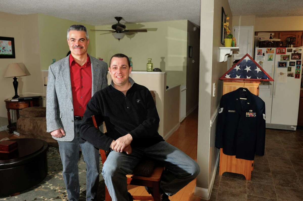 Realtor James Papaliosas, left, and homeowner Paul Gaffney at his home on Tuesday, Jan. 29, 2013, in Latham, N.Y. Both men are retired from the Air Force. (Cindy Schultz / Times Union)
