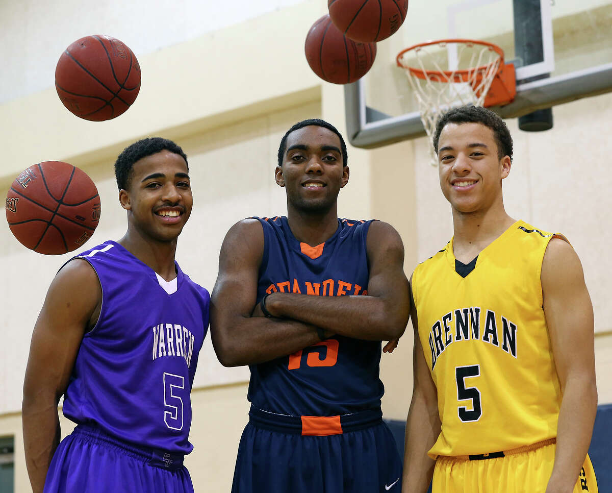 Warren's Marcus Keene, Brandeis' Justin Graham and Brennan's Johnny Azzinaro get together in the gym on January 30, 2013.
