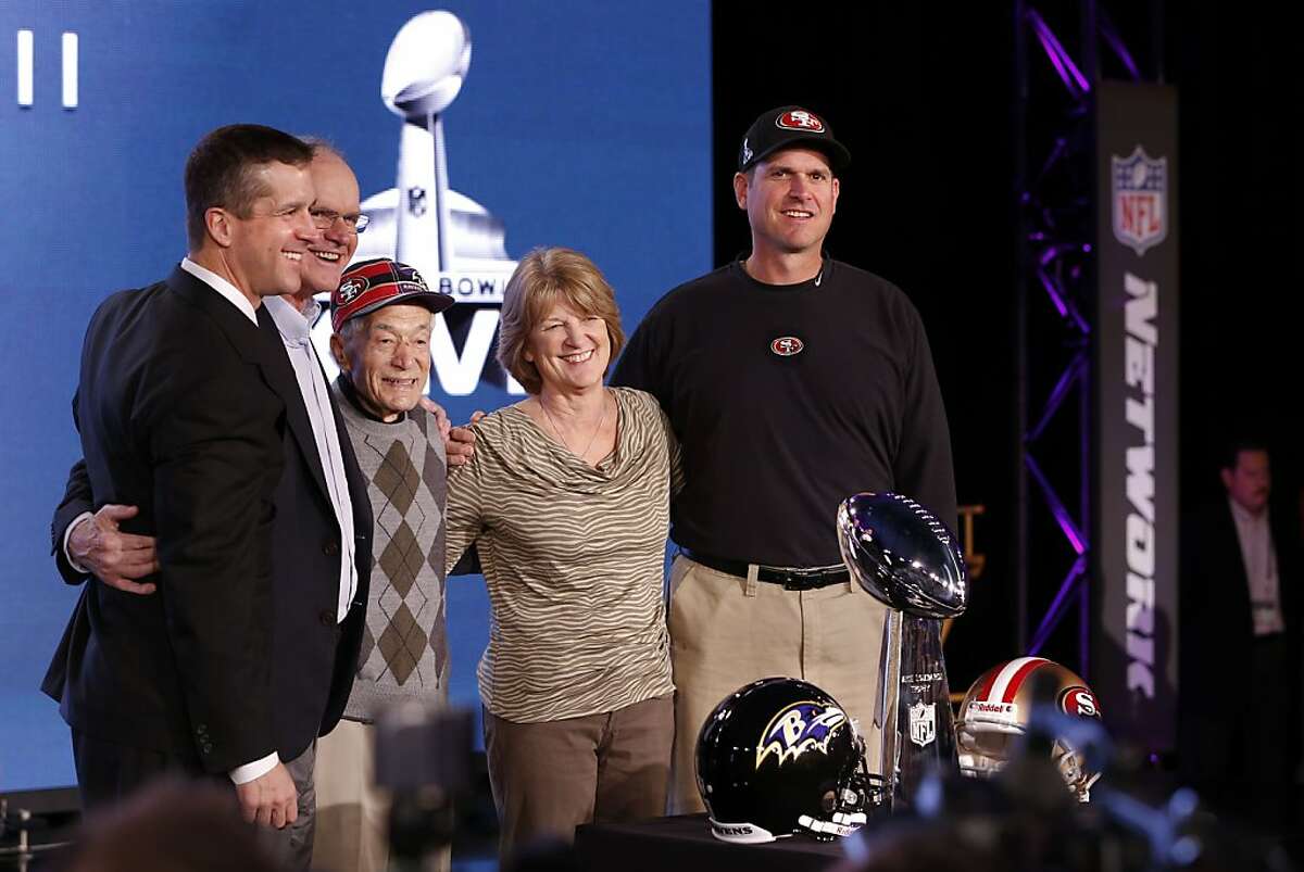 Harbaugh brothers stand apart together