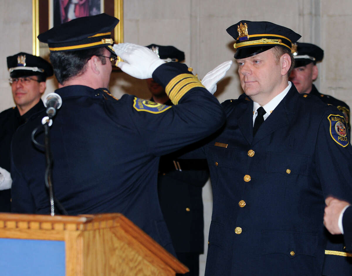 Chief Steven Krokoff salutes Lt. Michael Basile for his promotion during a swearing in ceremony of nine newly promoted members of the Albany Police Department at City Hall Friday Feb. 1, 2013 in Albany, N.Y. (Lori Van Buren / Times Union)
