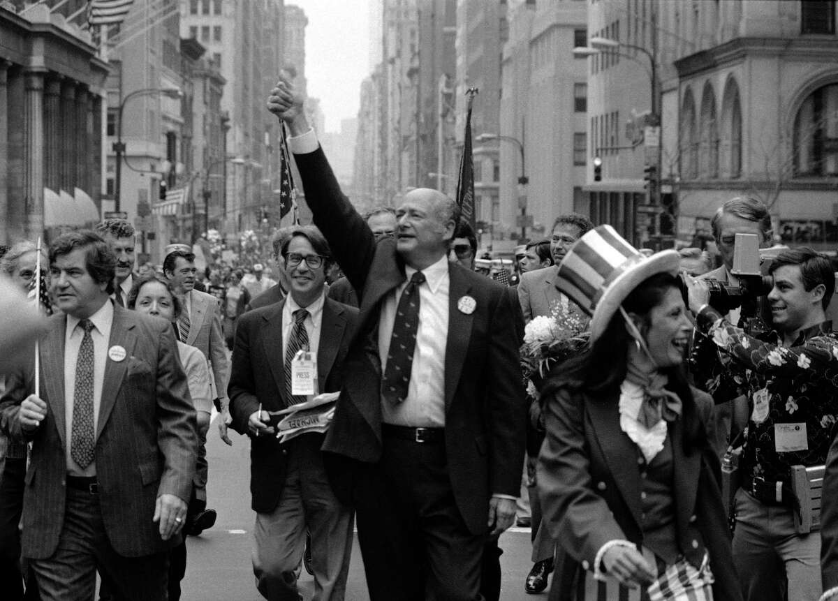 In this Sept. 7, 1981 file photo, New York City Mayor Ed Koch, center, gestures as he marches in a Labor Day parade down New York's Fifth Avenue. Koch died Friday, Feb. 1, 2013 from congestive heart failure, spokesman George Arzt said. He was 88. (AP Photo/Perez, file)