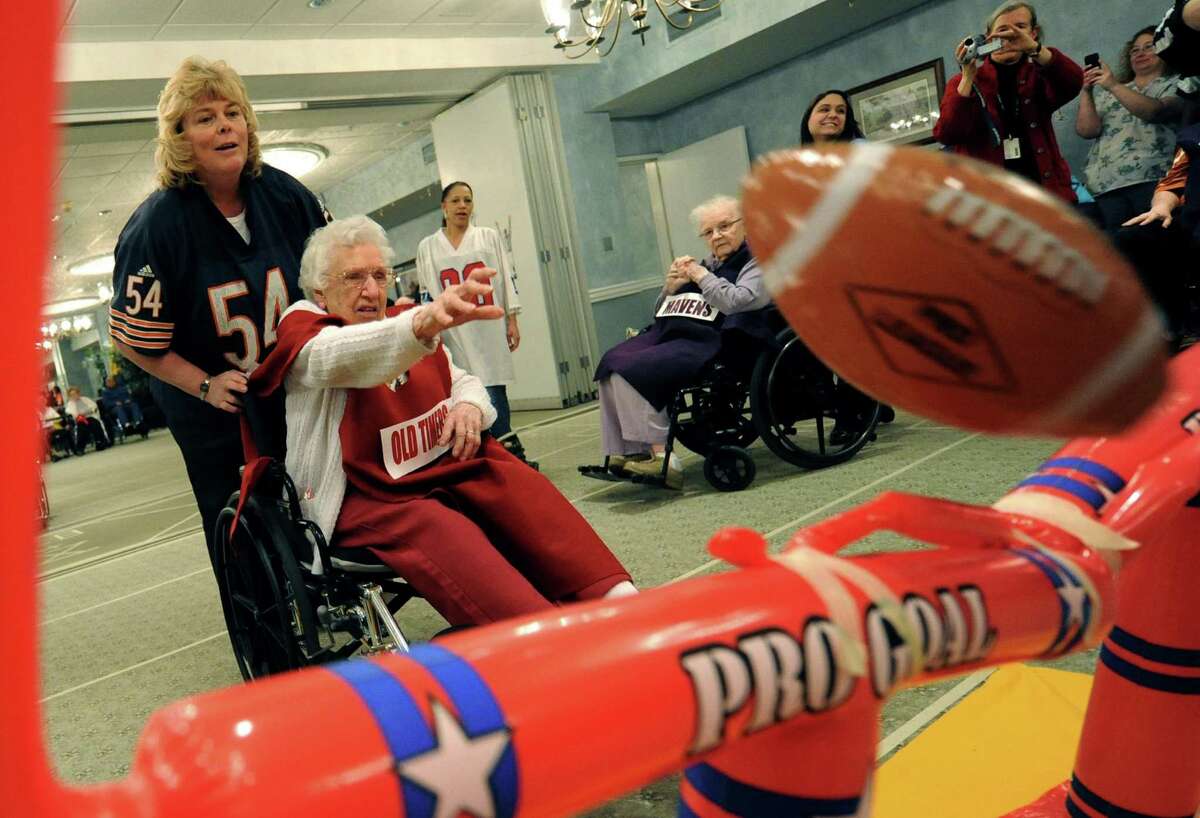 Old Timers Mabel Carcia, age 87, puts the extra point through the uprights during Wheelchair Bowl X at Teresian House Friday afternoon, Feb. 1, 2013, in Albany, N.Y. The Old Timers beat the Mavens 21-19. (Michael P. Farrell/Times Union)