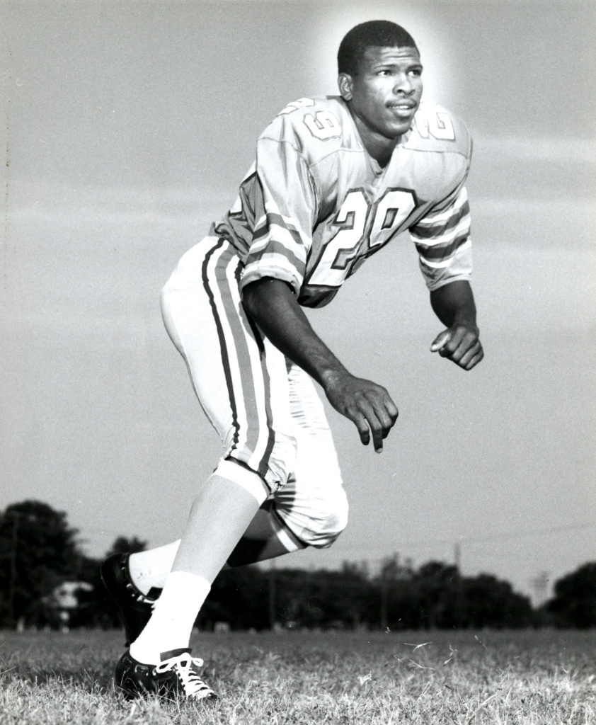 Houston Oilers quarterback Warren Moon (1) grimaces as he is