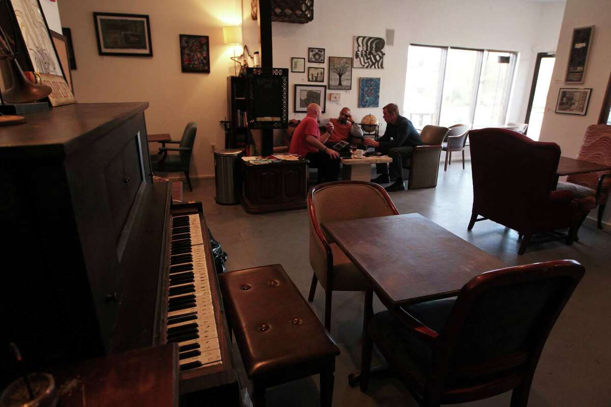 Customers inside the Doshi House Cafe Thursday, Jan. 10, 2013, in Houston. ( James Nielsen / Chronicle )