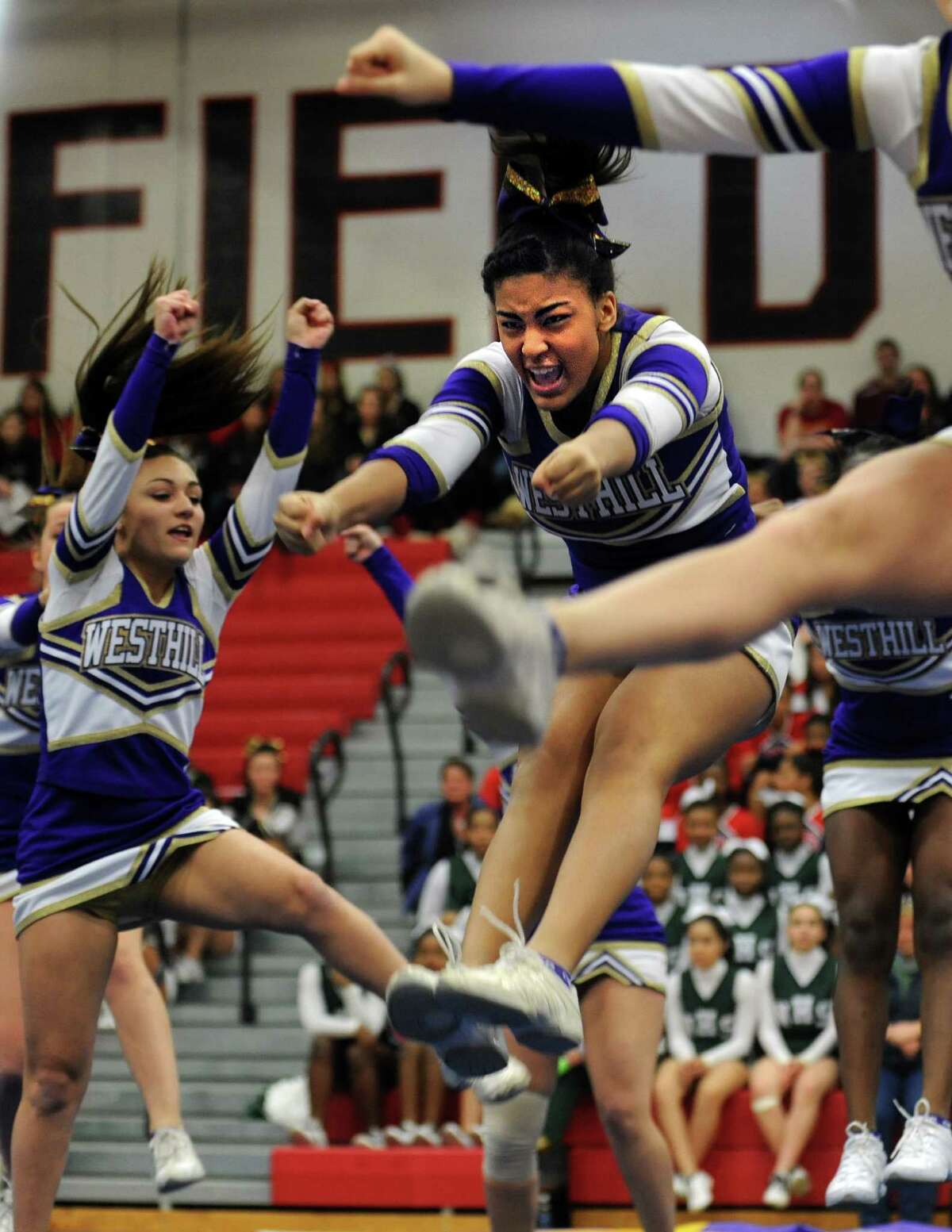 Westhill's Moriah Bass competes with her team during the FCIAC cheerleading championships Saturday, Feb. 2, 2013 at Fairfield Warde High School in Fairfield, Conn.