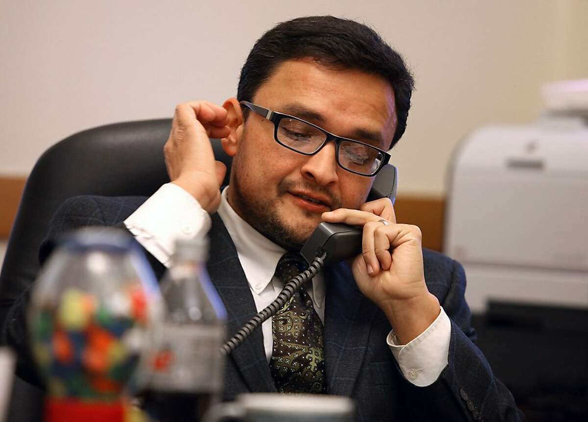 Supervisor David Campos talks with past supervisor Harry Britt at his city hall office in San Francisco, Calif., as he asks for support on his amendment on Monday, January 14, 2013. He will be introducing a charter amendment tomorrow that would rename San Francisco International Airport as Harvey Milk San Francisco International Airport .