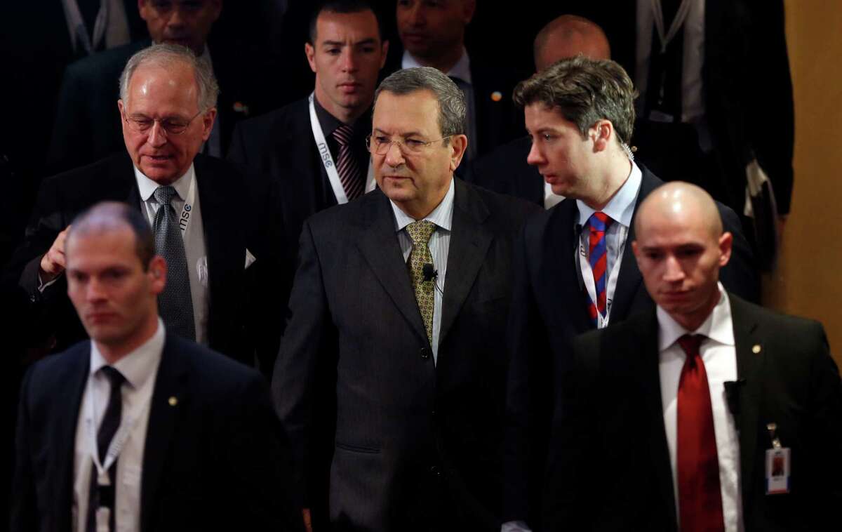 Israeli Defense Minister Ehud Barak, center, arrives for a meeting of the Security Conference in Munich, southern Germany, on Sunday, Feb. 3, 2013. The 49th Munich Security Conference started Friday until Sunday with experts from 90 delegations. (AP Photo/Matthias Schrader)
