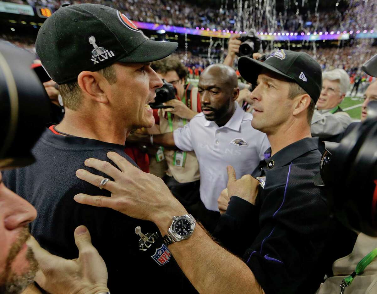 The Harbaugh brothers had a brief embrace after John, right, and his Ravens beat Jim and the 49ers.