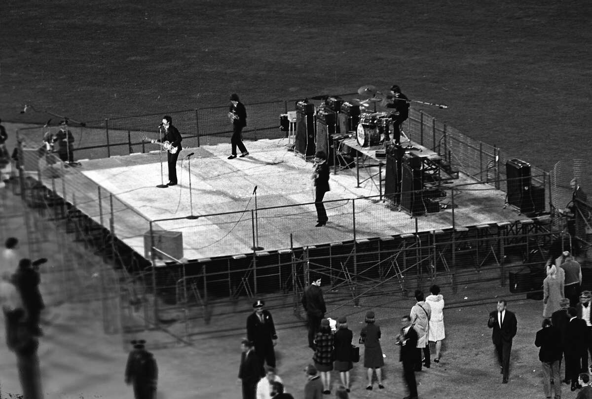 The Beatles perform at Candlestick Park on August 29, 1966.