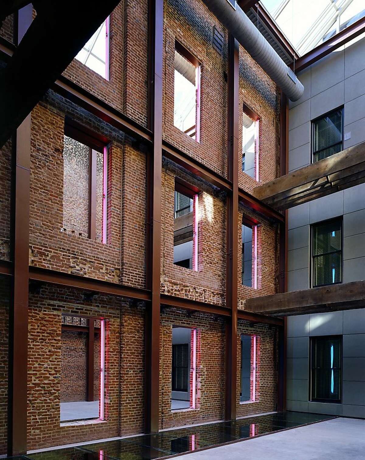 The 21C Museum Hotel in Louisville, designed by Deborah Berke Partners, converted four 19th Century warehouse buildings into a single compound, mixing contemporary details with such original elements as the brick structural walls.