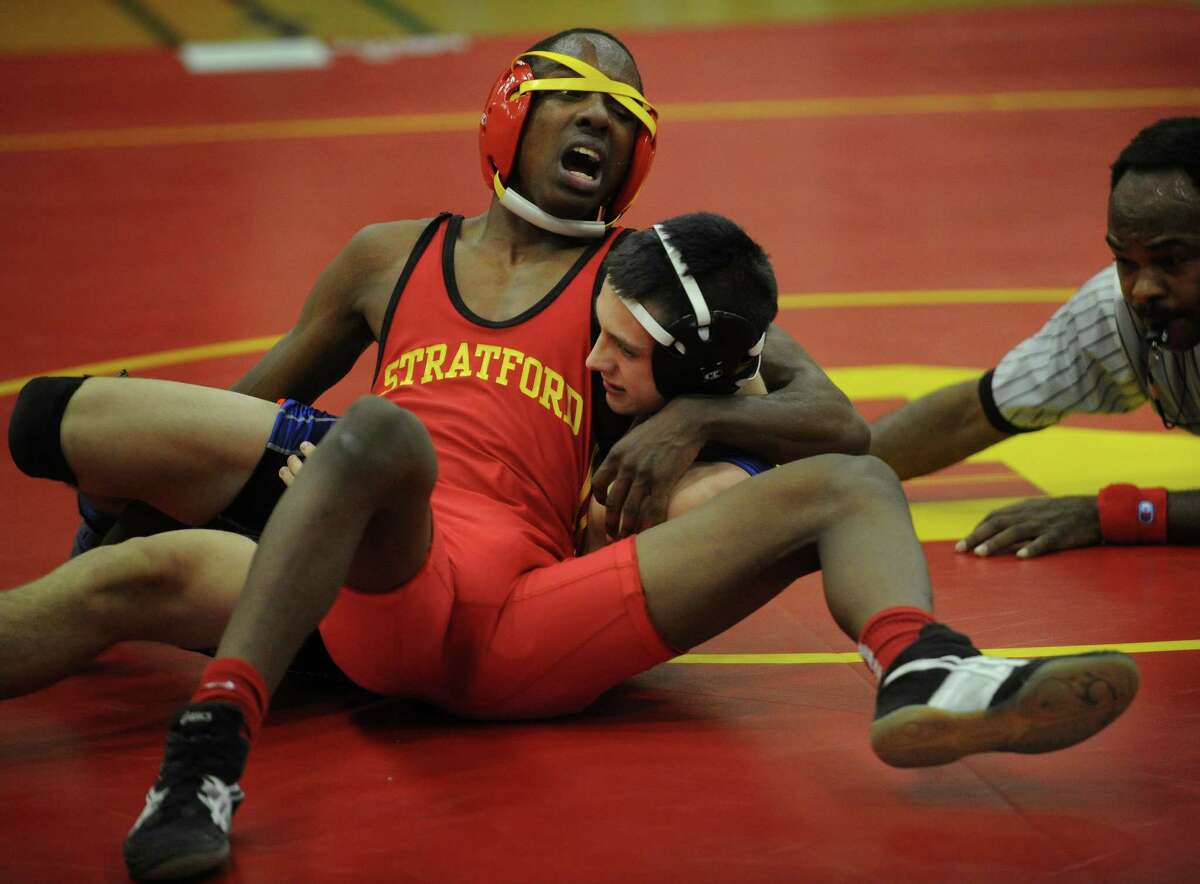Stratford's Mike Butler defeats rival Bunnell's Dante Gierula in a close match in the 126 pound class during their wrestling meet at Stratford High School on Monday, February 4, 2013.