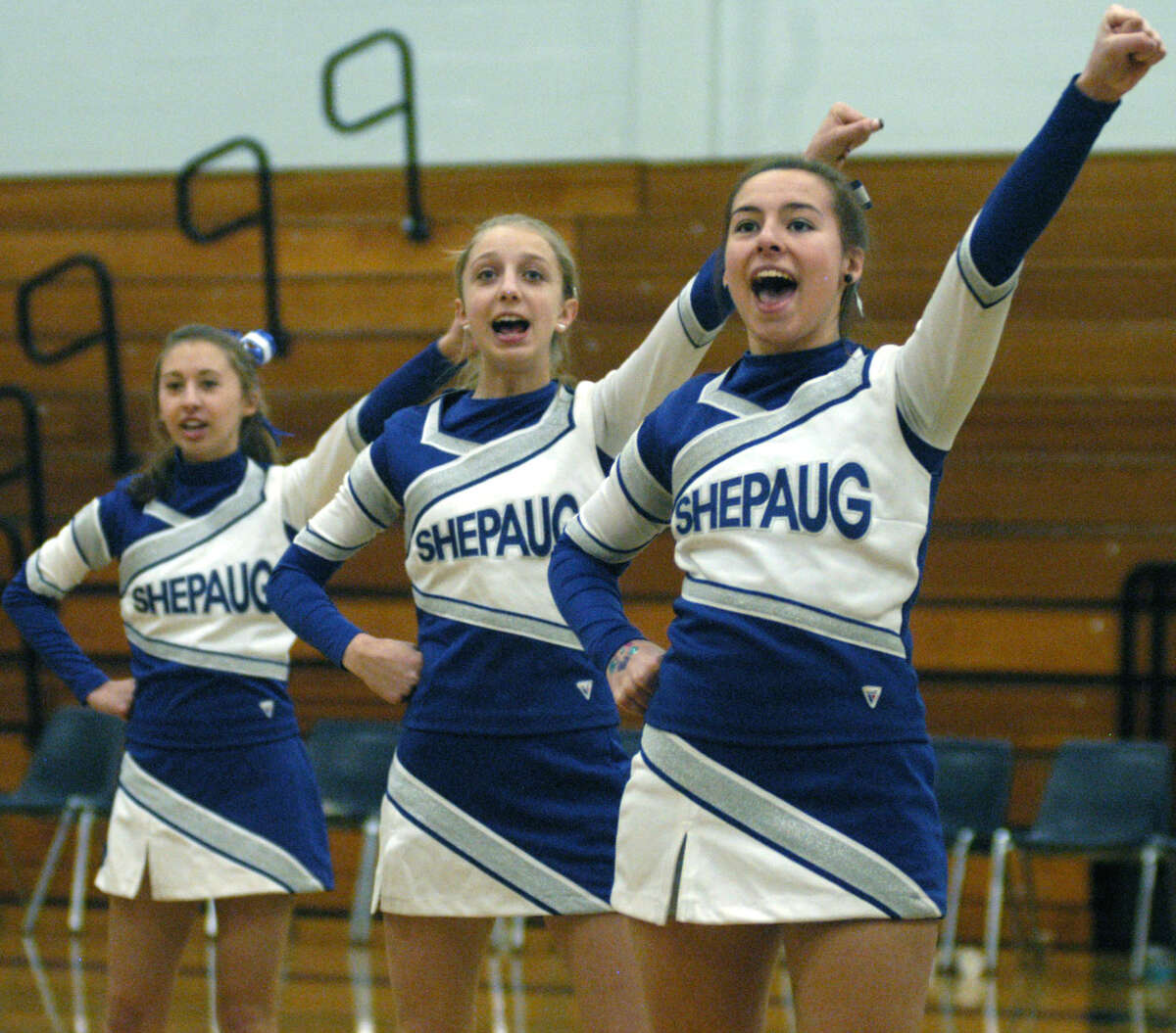 Go, Spartans! Shepaug Valley High cheerleaders, above, from left to right, Emma DelVecchio, Kaitlyn Smith and Bria Noone, fire up the crowd at Shepaug Valley High School boys' basketball's game vs. Gilbert, Jan. 18, 2013 in Washington. The girls lend vocal and emotional support to the Spartan boys' and girls' basketball teams during their home games. Contributing their talents are, right photo, from left to right, front row, Kayley Bresson, Bria Noone and Claire Caco; back row, Emma DelVecchio, Kaitlyn Smith and Lyndsey DelVecchio.