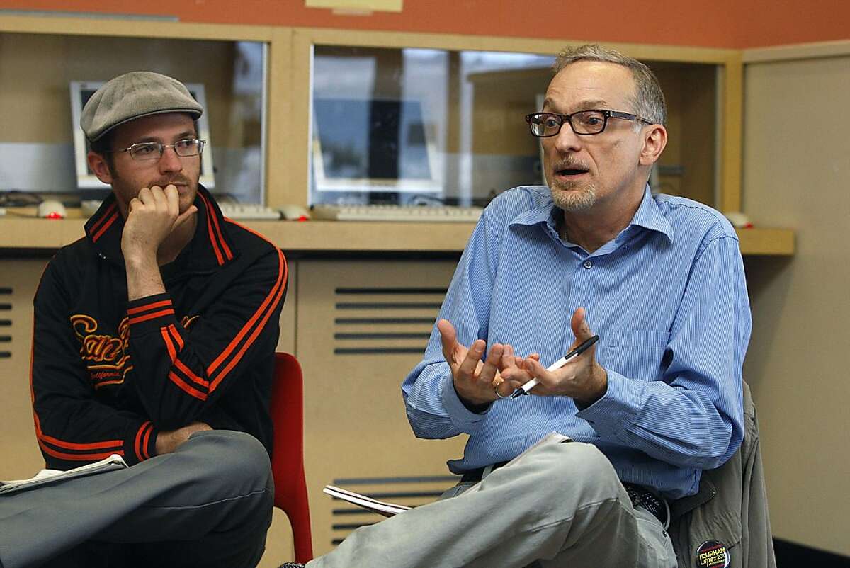CCSF student Eric Blanc (left) listening to chemistry teacher Bob Price (right) in a weekly meeting of The Save CCSF coalition in the lounge at CCSF student union in San Francisco, Calif., on Wednesday, October 10, 2012.