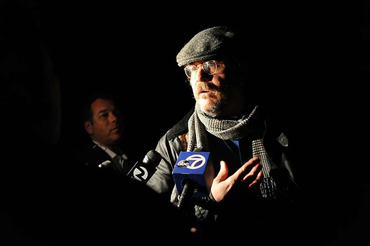 Ed Lark, who lives at one of the homes where a triple homicide took place on Ross Station Road in Forestville, California is approached by television reporters when he first arrived home after hearing about the crime. February 5, 2013.
