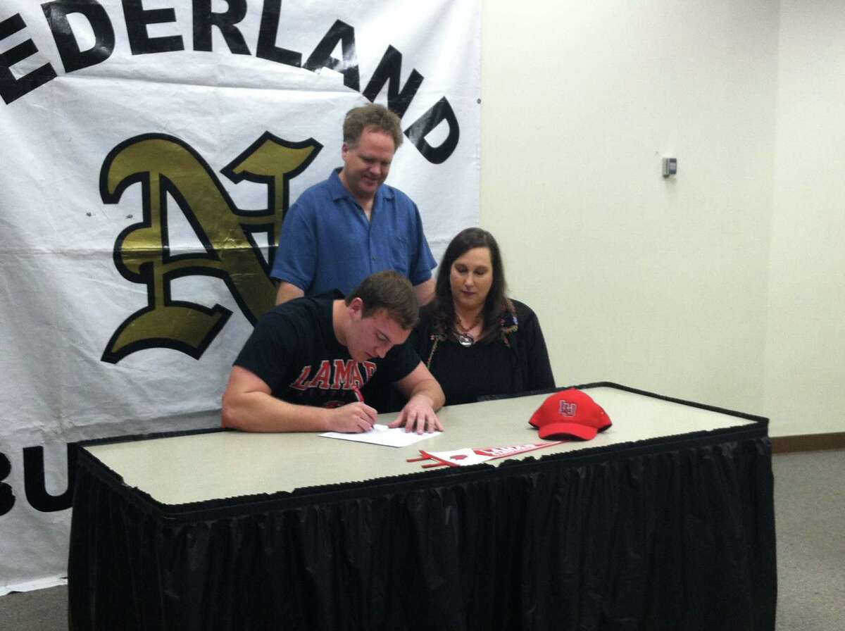Nederland football player Koby Couron signed with Lamar University on Wednesday, Feb. 6, 2012.