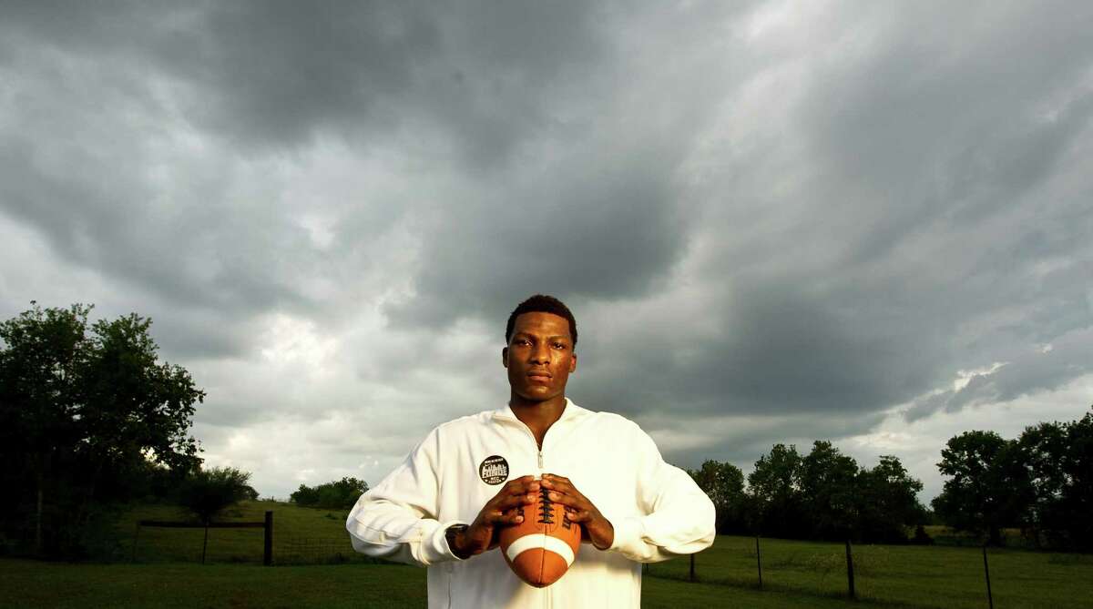 Ricky Seals-Jones, Sealy High School football star and one of the top ranked players in the country, stand on his families land as a storm passes Thursday, Oct. 11, 2012, in Sealy. Ricky's father Chester Jones says Ricky gets 15-20 recruiting letters daily.
