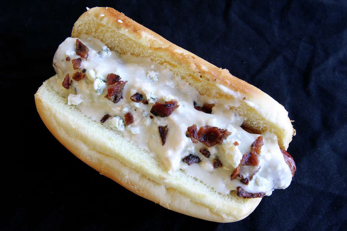 The S.A. Dog is bacon-wrapped and covered in melted blue cheese.