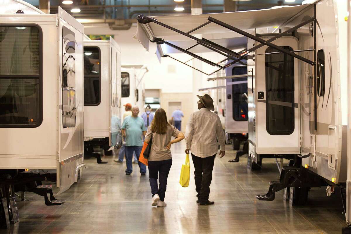 Visitors to the Houston RV Show look over the models on display at Reliant Center. The show runs through the weekend.