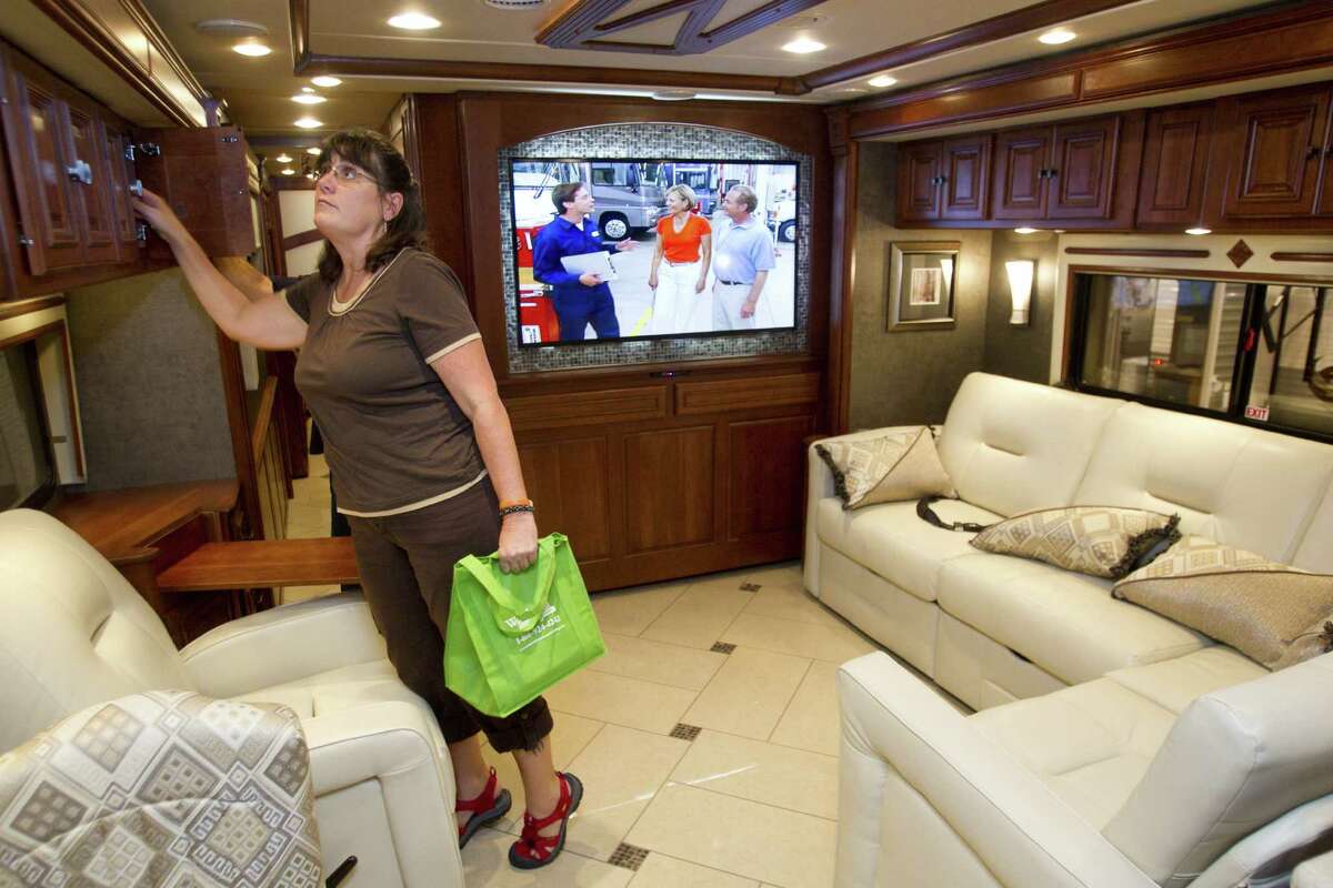 Recreational vehicles, like the Winnebago Tour 42GD at the Houston RV Show at Reliant Center, are saving two to three feet of cabinet space with flat-screen TVs, allowing more room for such items as L-shaped sofas.