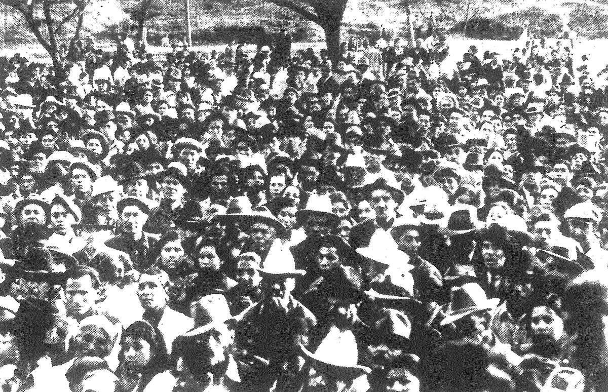 Four thousand striking pecan shellers and sympathizers hear Congress of Industrial Organizations (C.I.O.) leaders speak in Cassiano Park. The strike leadership of Donald Henderson, cannery union chief, was endorsed by the crowd at a meeting on the West Side Sunday. Published in the San Antonio Light Feb. 14, 1938.