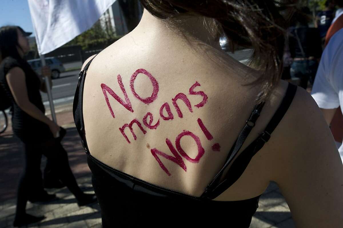 (FILES) -- A file photo taken on August 20, 2011 shows the words "No means No " written on the back of a woman as more than a thousand people march through the city of Cape Town, taking part in the first Slut Walk. The rape and gruesome mutilation of a 17-year-old in South Africa has sparked rare outburst of anger in a country that often appears numb to sexual violence. Anine Booysen was found disembowelled at a construction site in the southwestern town of Bredasdorp at the weekend. She later died in hospital, but not before she identified one of her attackers. AFP PHOTOSTR/AFP/Getty Images